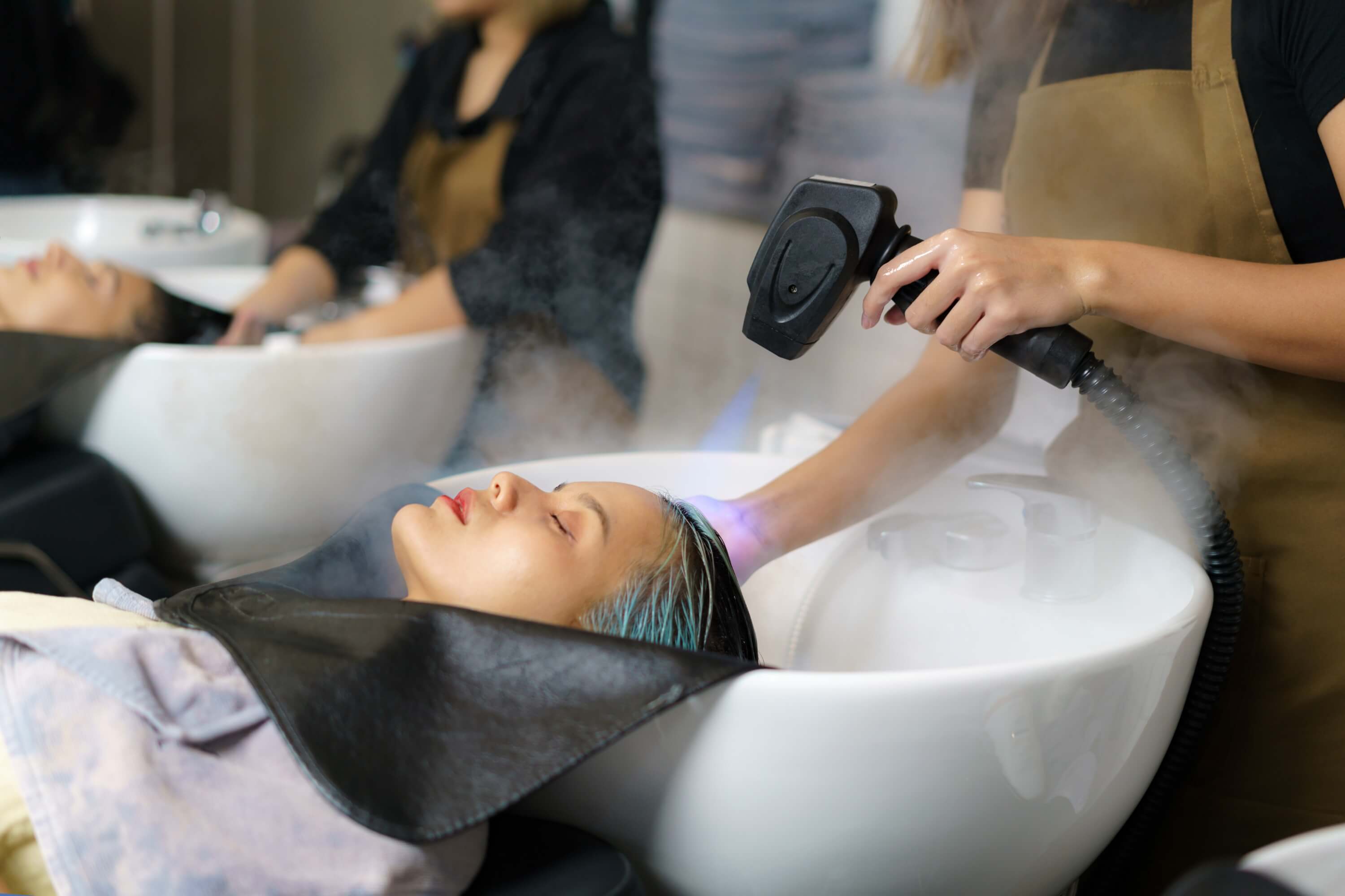 Professional head spa training session with steam scalp treatment at Vital Glow