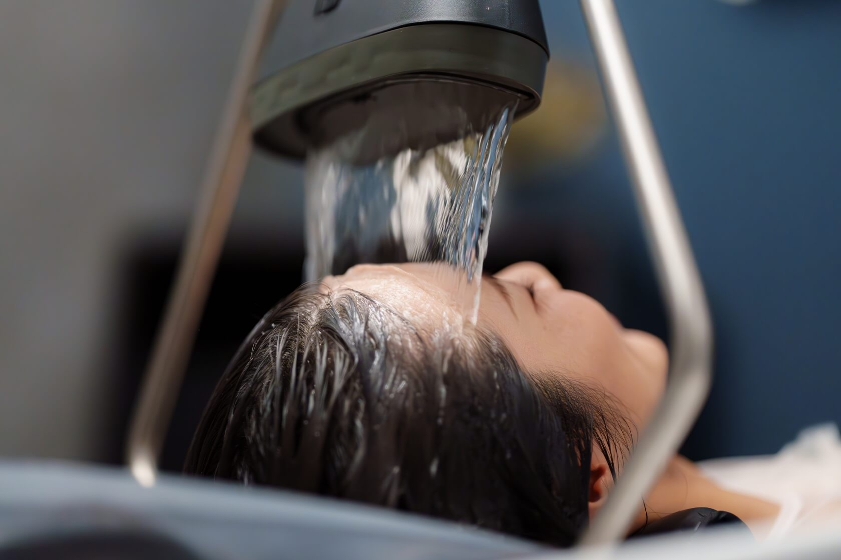 Vital Glow head spa waterfall scalp therapy treatment with soothing water flow over the forehead